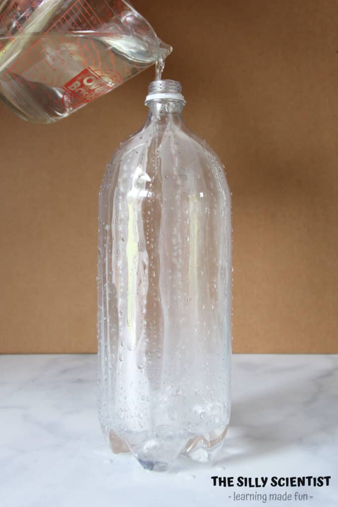 pour warm water into bottle