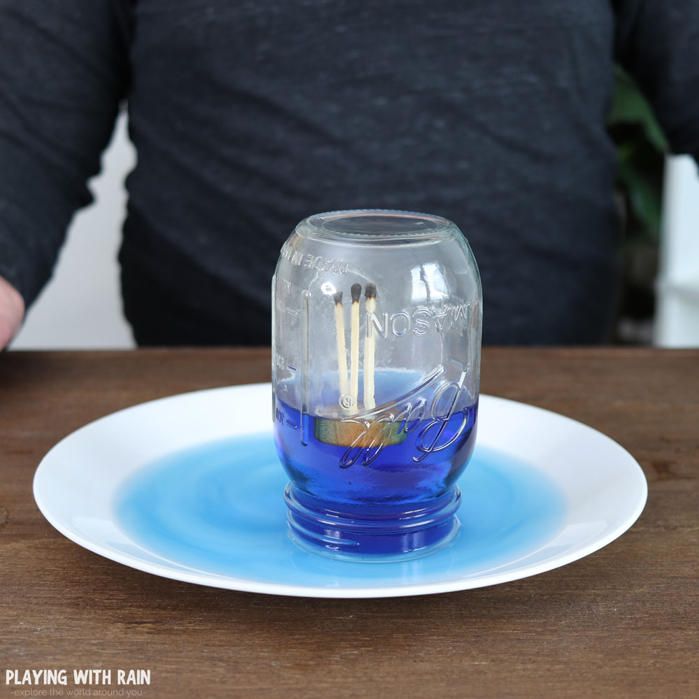 water rising in an upside-down jar