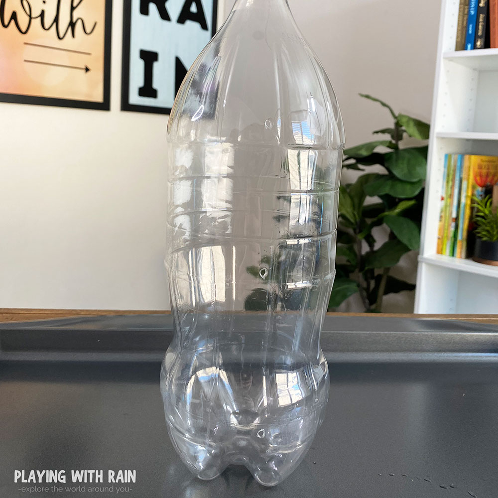 2 liter bottle with three holes in it