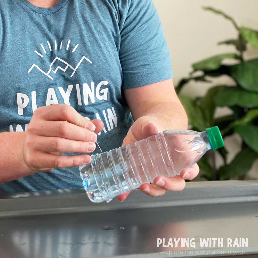 https://playingwithrain.com/wp-content/uploads/2021/01/Poking-holes-in-water-bottle.jpg