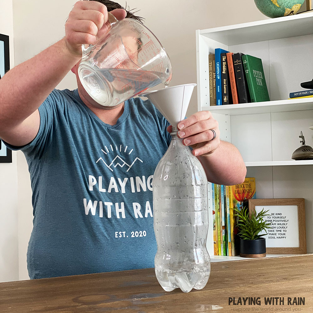 Pour hot water into a bottle