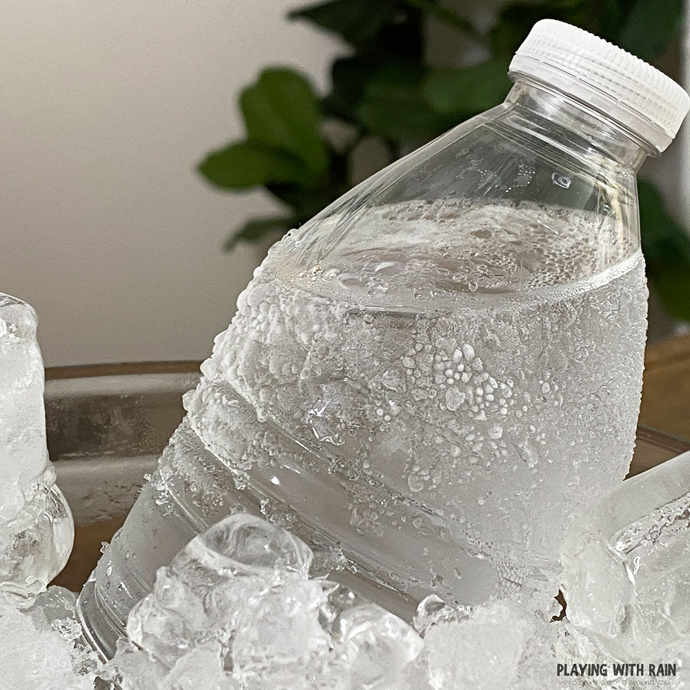 Condensation droplets freeze on outside of bottle when supercooled