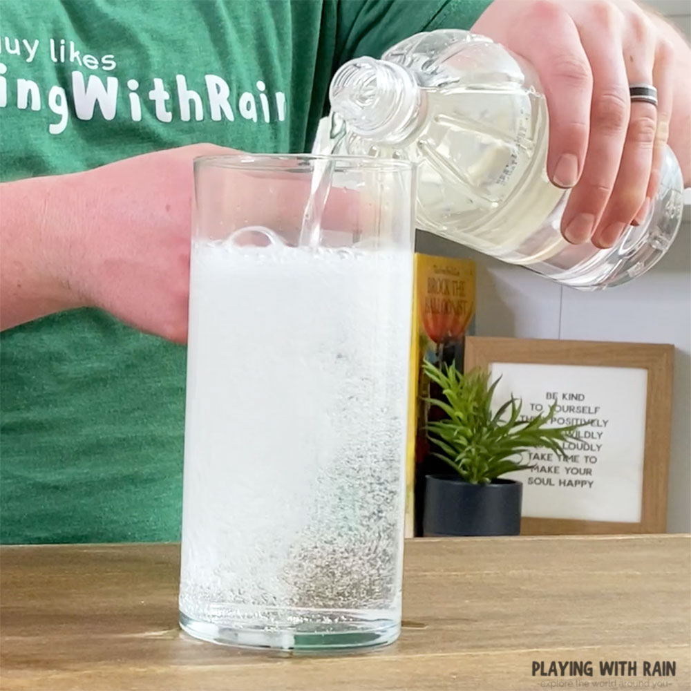 Pour vinegar into water and baking soda mixture