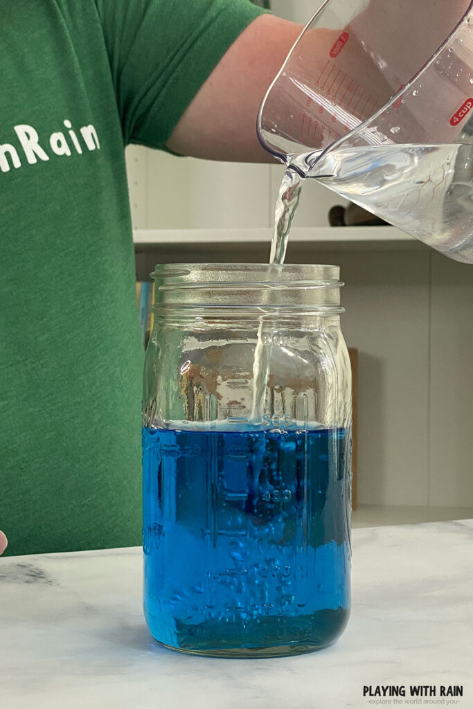 Pouring water into a jar
